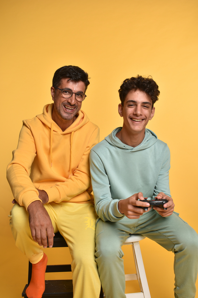 Father and Son on Yellow Background